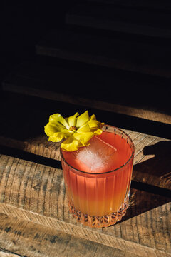 Tropical Cocktail With Yellow Flower In The Sun