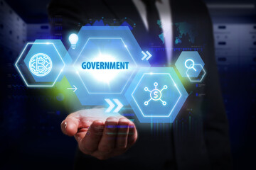 Business, Technology, Internet and network concept. Young businessman working on a virtual screen of the future and sees the inscription: Government