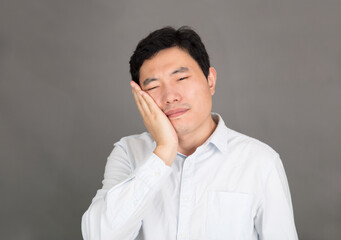 Young man suffering from toothache
