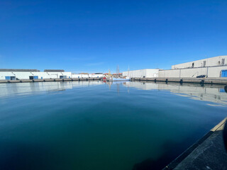 A boat docked in the sunshine