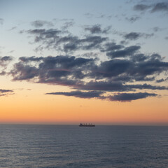 Naklejka na ściany i meble Sunset in the North Sea from on board a cruise ship