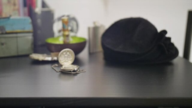 Black Gloves Picking up Keys