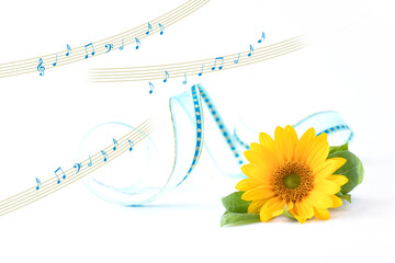 ヒマワリの花束と楽譜の合成	
