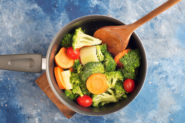 cooking vegetable stew in a saucepan