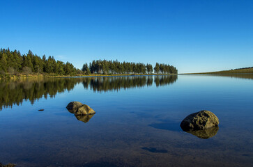View of the volcanic lake Sevieres in Auvergne Volcanoes Natural Regional Park