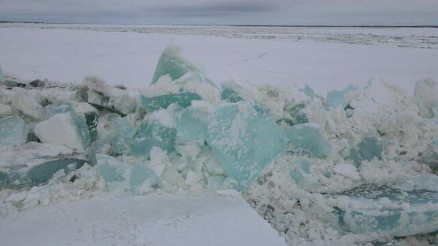 a mountain of cracked ice on the yenisei river Dudinka Taimyr Siberia