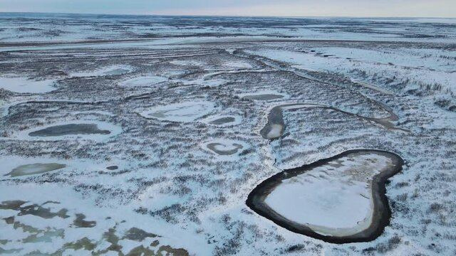 The lakes under ice on the tundra on Taimyr in spring