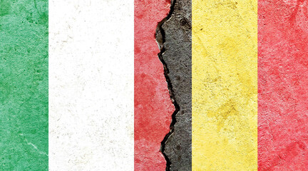 Italy and Belgium flags on a cracked wall surface © C A/Wirestock
