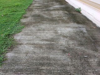 The pavement is rough concrete.