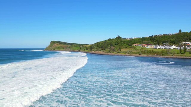 Distant View Of The Pat Morton Lookout At Lennox Head Mainland And The Ocean Waves Of Seven Mile Beach In Australian State Of New South Wales. aerial