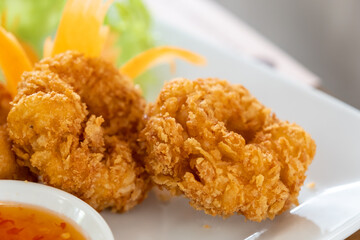 Deep fried shrimp cakes in a white plate on the tableware
