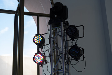 LED PAR lights hanging on a truss at event professional lighting device colored equipment