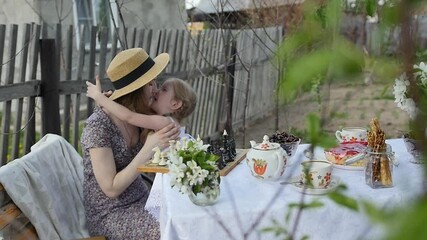 In the spring, mother and daughter spend too much time in the apple orchard. Happy family concept - Powered by Adobe