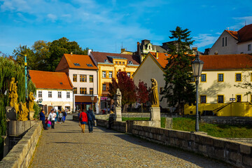 Cityscape of Czech town Pisek with stone bridge and old city