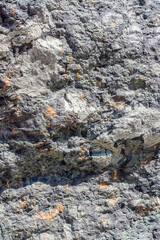 The texture and pattern of a multicolored stone. Natural stone background. Mineral resources.