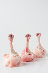 Raw chicken Lollypops, white background, isolated.