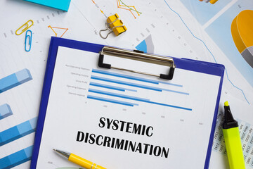 Business concept meaning Systemic Discrimination with inscription on the piece of paper.