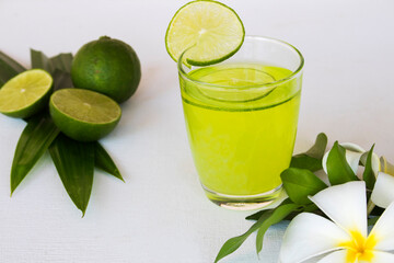 herbal healthy drinks pandan and lemon with flowers frangipani arrangement flat lay style on background white wooden