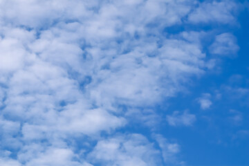 Fototapeta premium Background of blue sky with white clouds. High quality photo