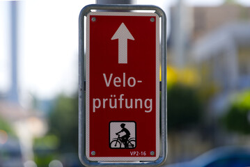 Traffic sign with text Velopr&uuml;fung (German, translation is bicycle test) at City of Zurich at a sunny summer day. Photo taken June 16th, 2021, Zurich, Switzerland.