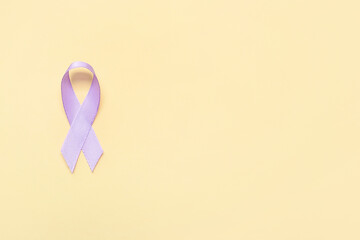 Lilac ribbon on color background. Cancer awareness concept