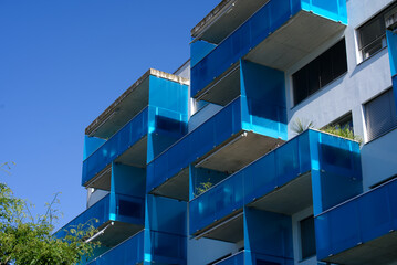 Apartment building at Zurich Schlieren with stylish blue balconies at a sunny summer morning. Photo taken June 15th, 2021, Schlieren, Switzerland.