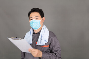 Professional workers wearing masks holding documents in hand