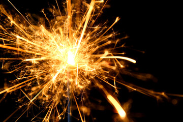 A sparkler is a type of handheld firework that burns slowly while emitting colored flames, sparks, and other effects.