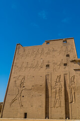 Vertical view of hieroglyphs at the entrance to the Temple of Edfu (Horus Temple) in Edfu, southern Egypt