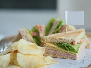Sandwiches stuffed with ham and lettuce, whole wheat bread