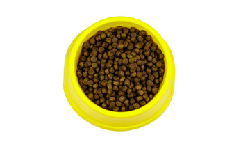 Dry food for cat or dog in a bowl. Top view. Pet food isolated on white background