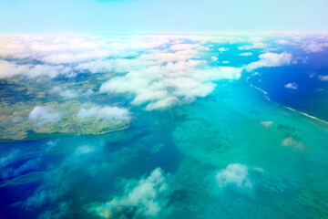 Fototapeta na wymiar Above the Clouds - Ariel View of Islands and Ocean 