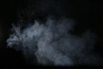 Artificial magic smoke isolated on dark background