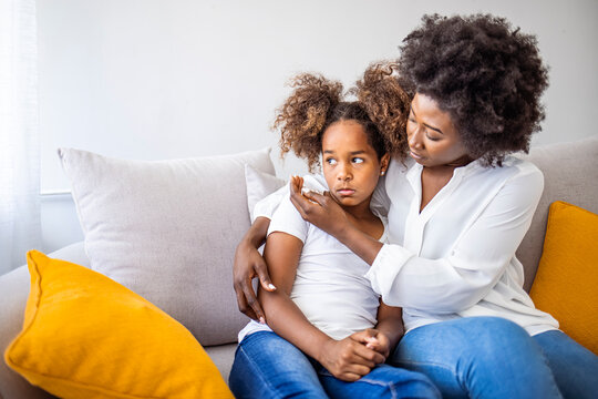 Worried Young Foster Care Parent Mother Comforting Solacing Embrace Adopted Little Child Daughter Give Care And Protection At Home, Loving Concerned Adult Mom Hug Sad Small Girl Consoling Kid Concept