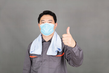 Thumbs up for young workers wearing masks