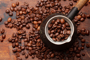 Roasted coffee beans and Turkish jezve
