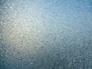 Icy pattern on frozen window glass