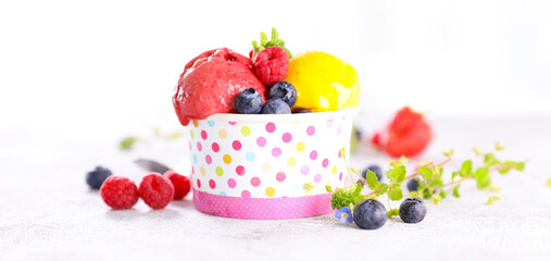 ice cream scoop with berries fruits