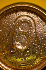 key on a cold metal beer can with condensate