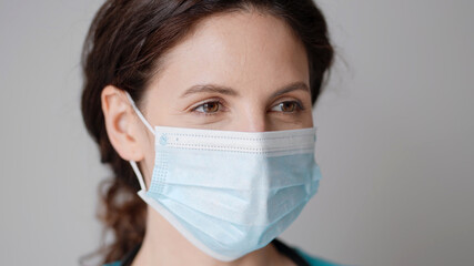 Doctor woman nurse medical masc close up in hospital portrait