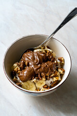 Chocolate Peanut Butter Flavored with Cocoa in Healthy Breakfast Bowl and Porridge.