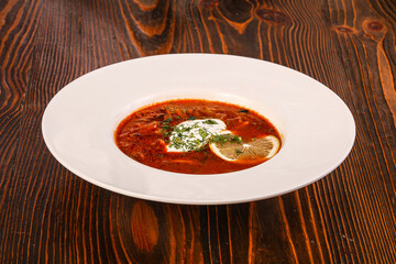 Russian traditional Solyanka soup with sausages