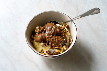 Chocolate Peanut Butter Flavored with Cocoa in Healthy Breakfast Bowl and Porridge.