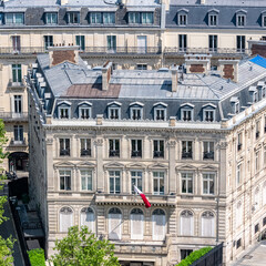 Fototapeta na wymiar Paris, beautiful Haussmann facades and roofs in a luxury area of the capital, view from the triumph arch 