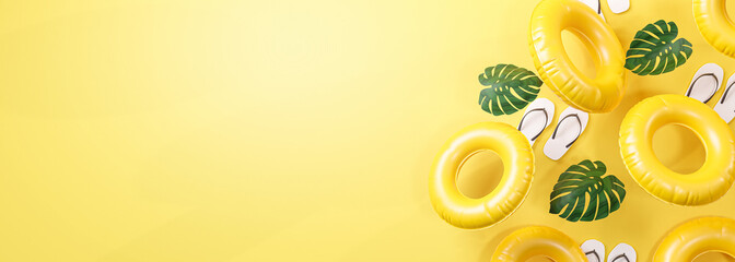 Summer Banner Yellow Background. Flip Flops, Leaf and Inflatable Swimming Ring Copy Space 3D Rendering - 439999139