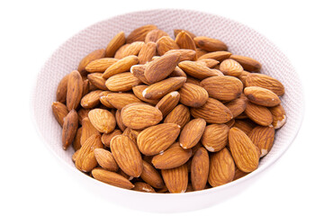 Almonds in a white dish on a white background.Isolated products and items