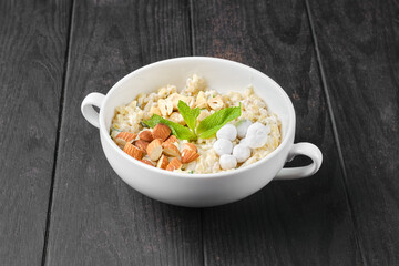Bulgur porridge with nuts and cranberries in sugar pouder breading