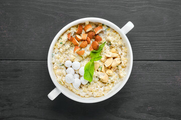 Overhead view of bulgur porridge with nuts and cranberries in sugar pouder breading