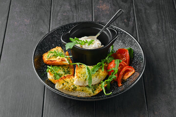 Toasted garlic bread, tomato and chicken pate