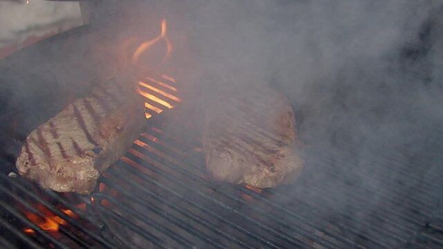 BBQ steack on grill. Grilling on fire meat